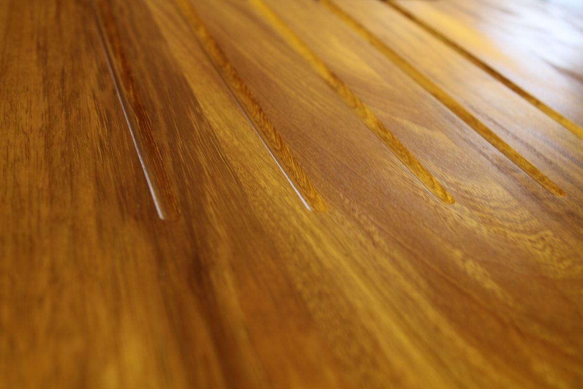 Close-up of drainer grooves in an oiled golden hardwood worktop