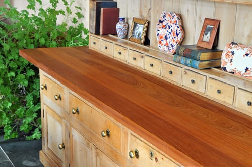 Rich reddish-brown sapele worktop fitted to a pine dresser