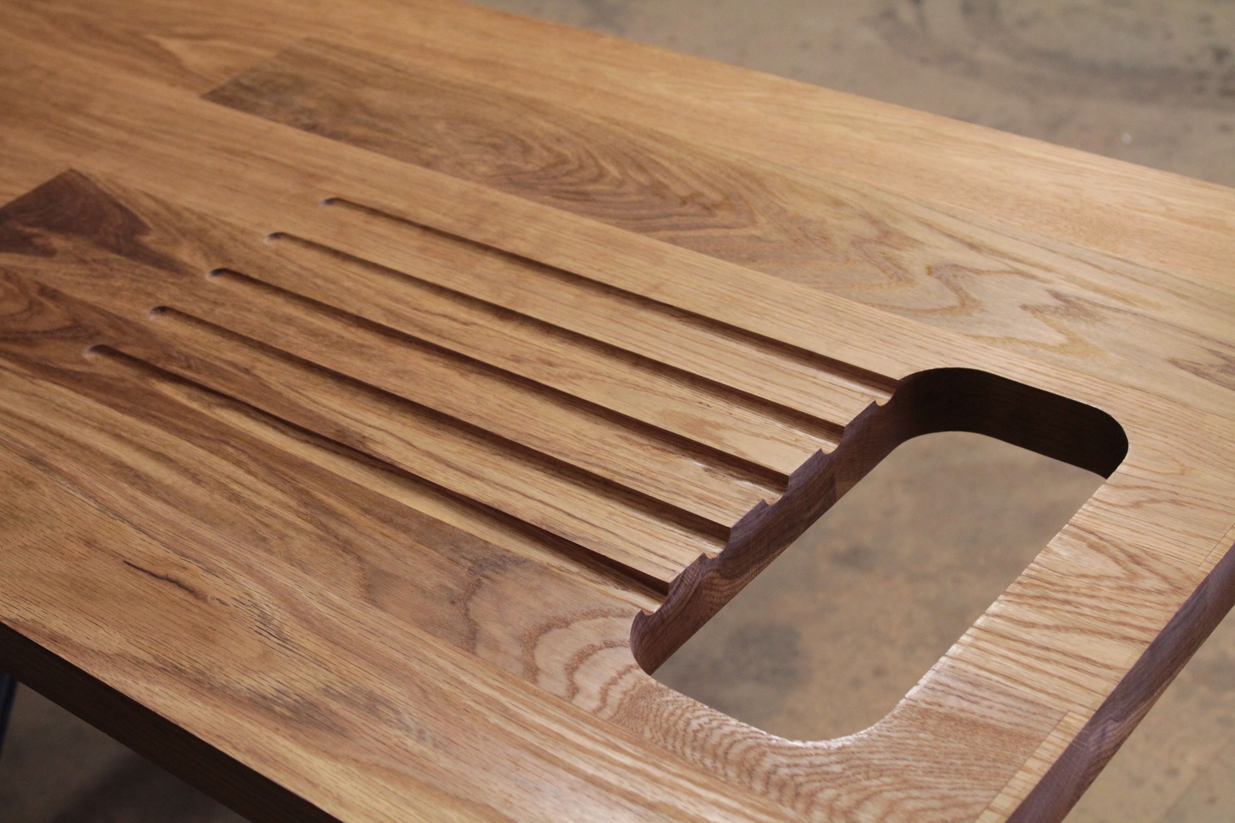 Oiled oak worktop with routed drainage grooves and a sink cut-out